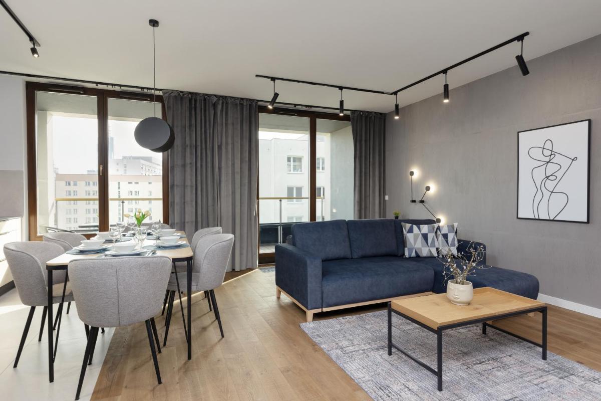 Business Apartment Wola with Parking Place by Noclegi Renters