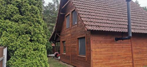 Dom drewniany z kominkiem i klimatyzacja lokalizacja trzy jeziora i lasy swornegacie