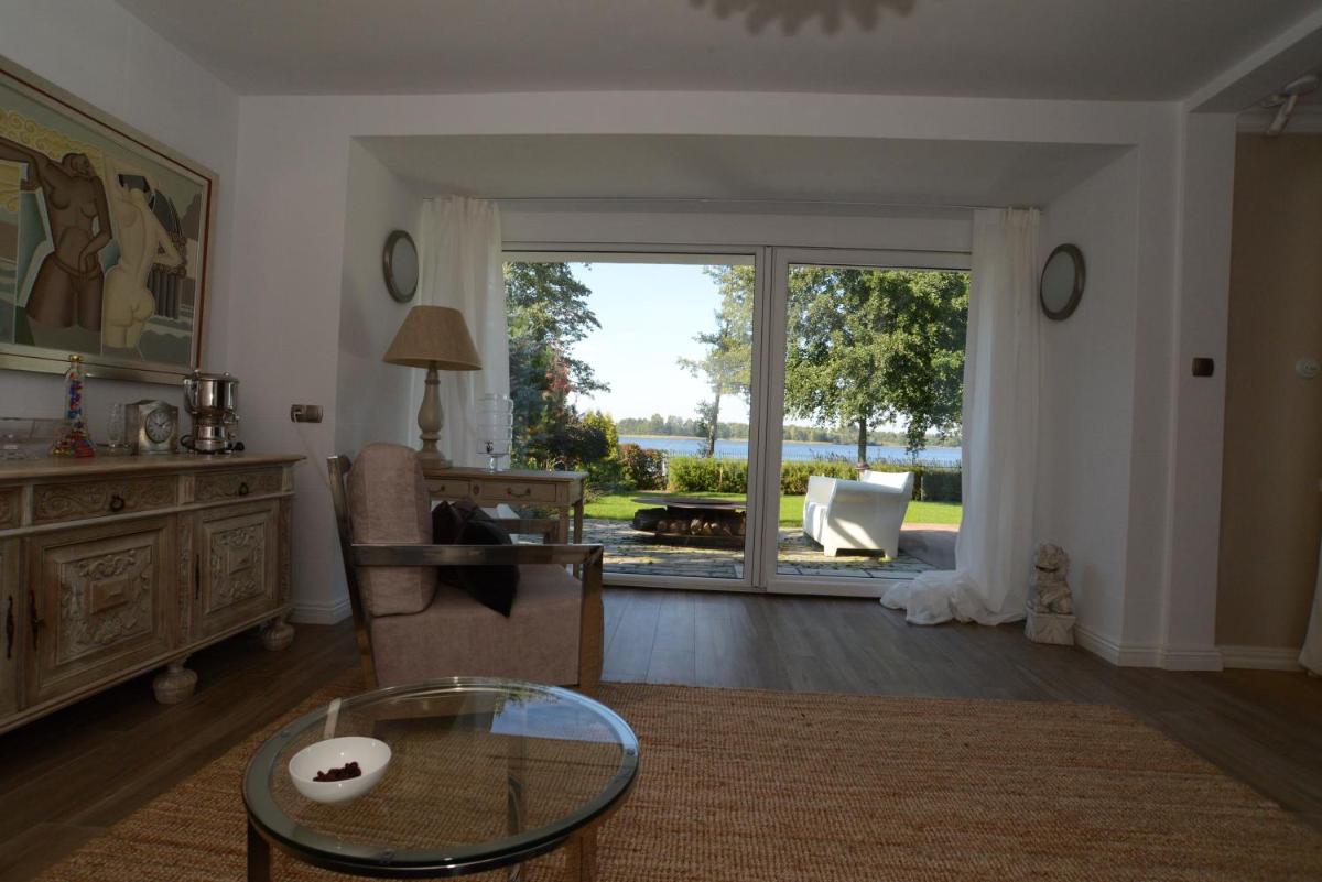 Mazurska Villa Deluxe w Pasymiu z prywatnym pomostem na jezioro Kalwa i łodzią na wyłączność Najwyższe Premium w Osada Zamkowa